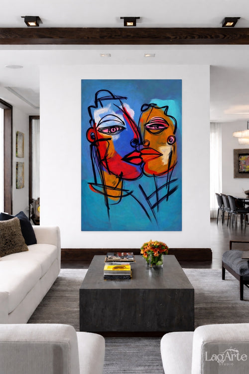 Abstract expressionist face canvas wall art in blue and red tones displayed in modern living room